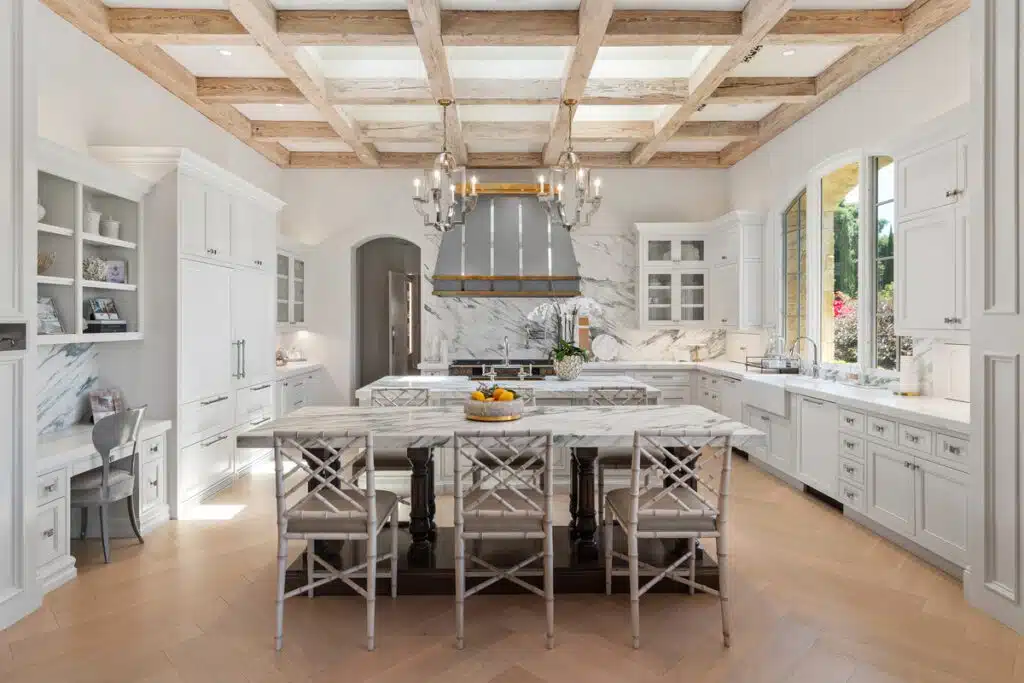 A beautifully designed dining room featuring natural lighting streaming through large windows. The room’s elegant furniture and modern decor create a sophisticated and inviting space.