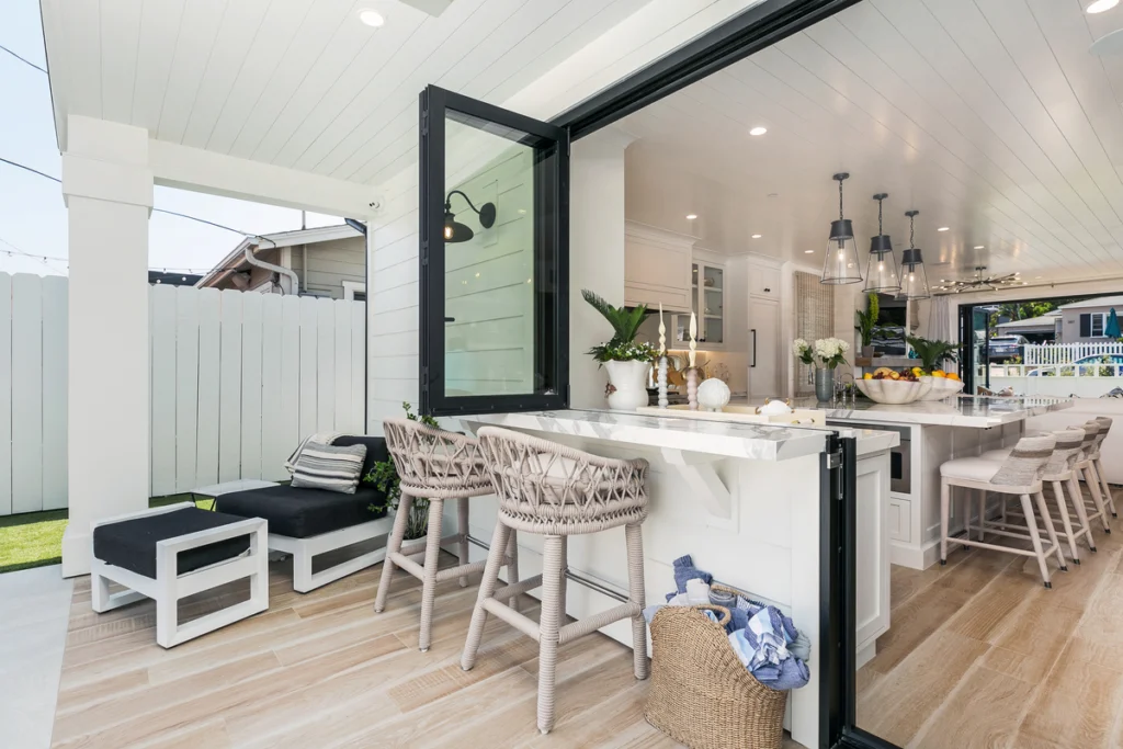 A spacious living room with an open layout, featuring stylish furniture and a touch of art that enhances the modern design. The room's layout promotes a comfortable yet sophisticated space for both family and guests.