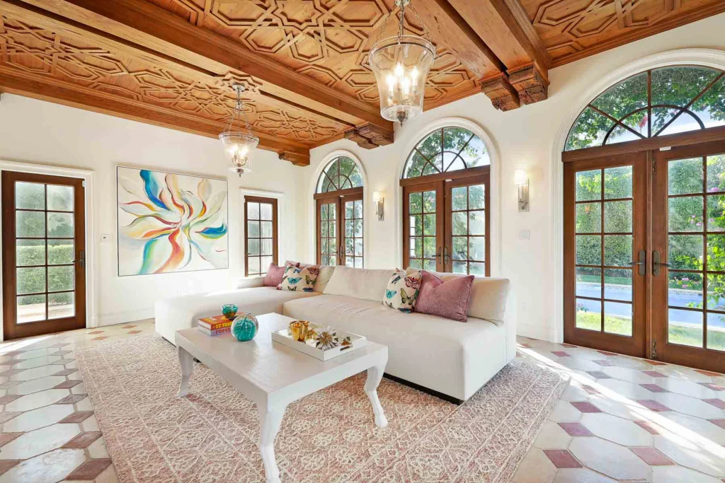 A spacious living room featuring modern furniture, warm tones, and a sophisticated layout, creating an inviting atmosphere perfect for family gatherings.