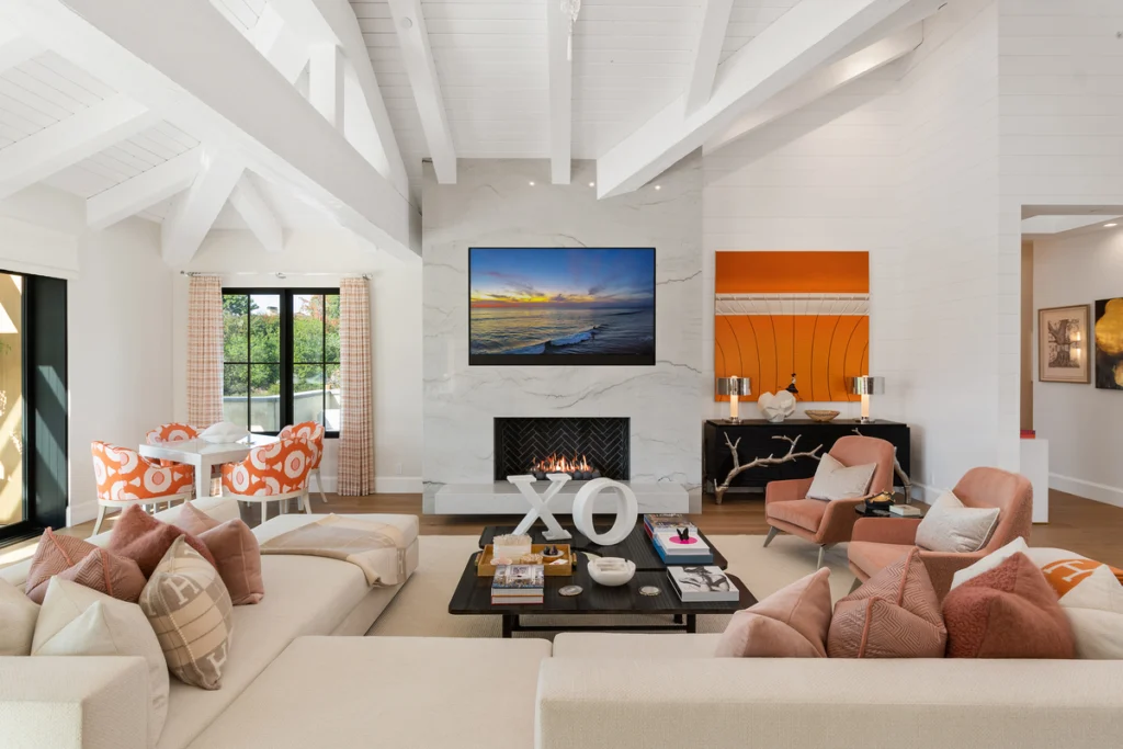 A bright and inviting family room with timeless design elements, featuring comfortable seating, elegant decor, and a welcoming atmosphere for family gatherings.