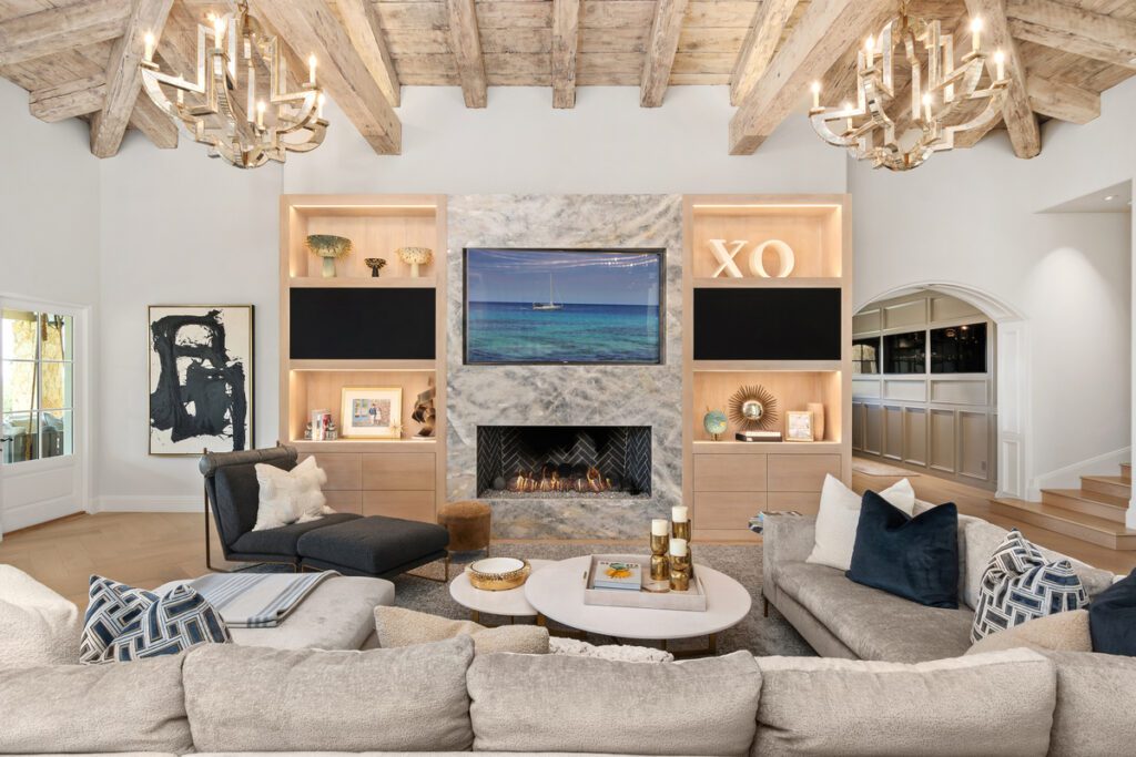 An elegant living room featuring soft lighting, stylish furniture, and a welcoming atmosphere. The space is designed to offer both comfort and sophistication, ideal for family and guests.