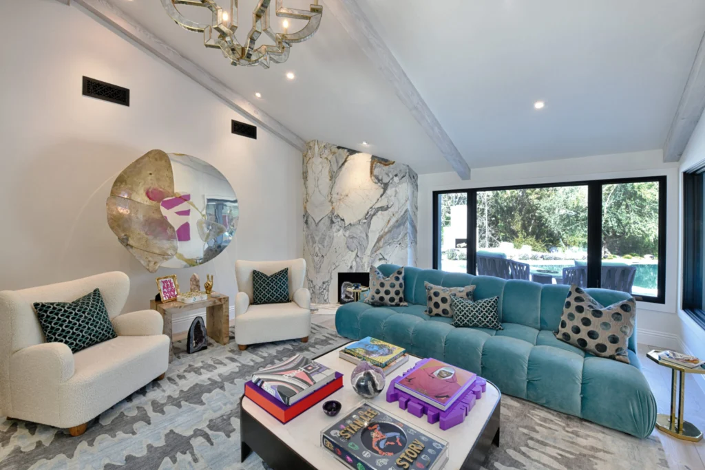 A stylish living room with an open layout, modern furniture, and bright natural light. The design promotes a spacious, welcoming atmosphere perfect for relaxation and social gatherings.